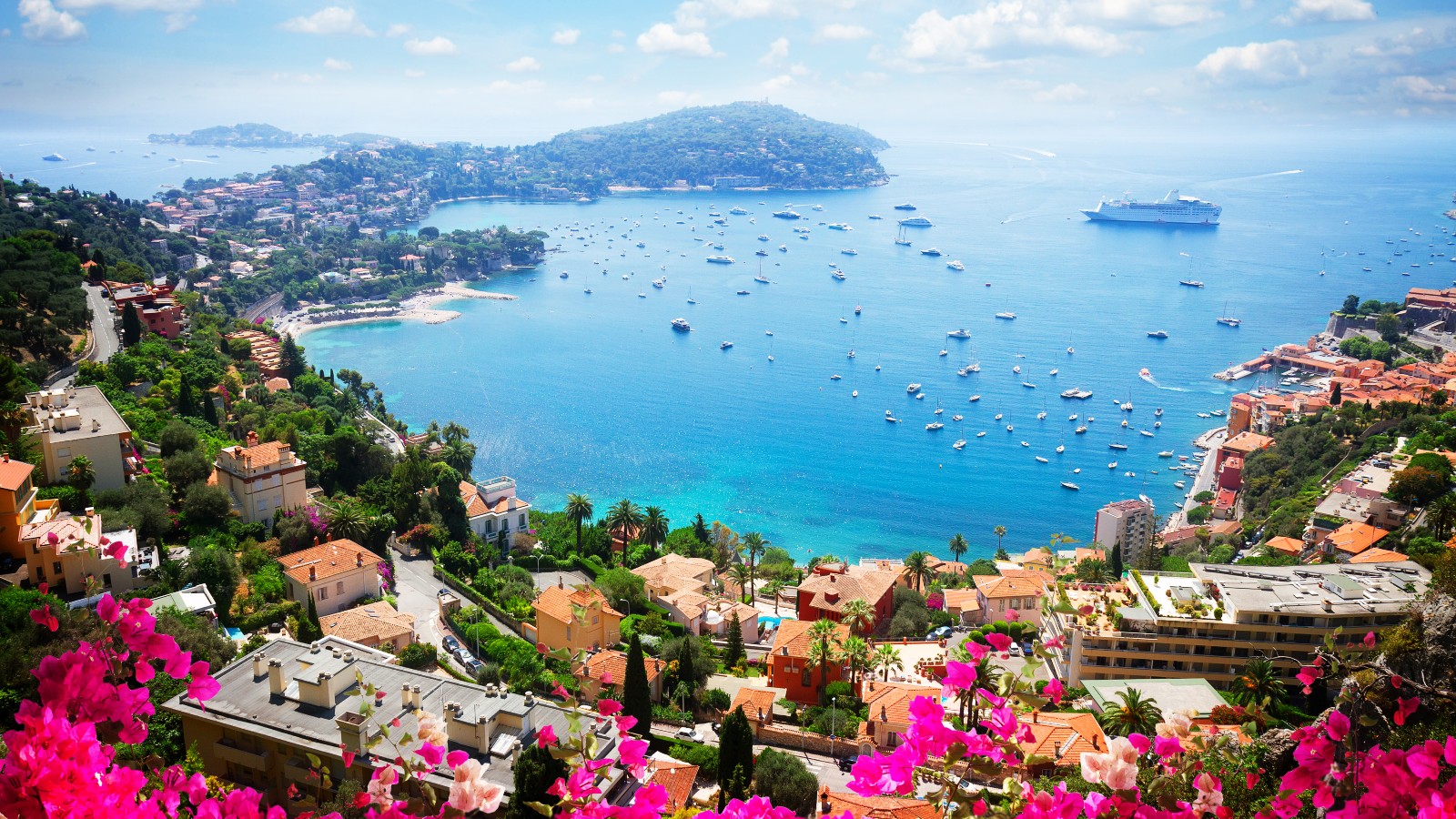 Landscape of riviera coast, turquiose water, flowers and blue sky of cote dAzur