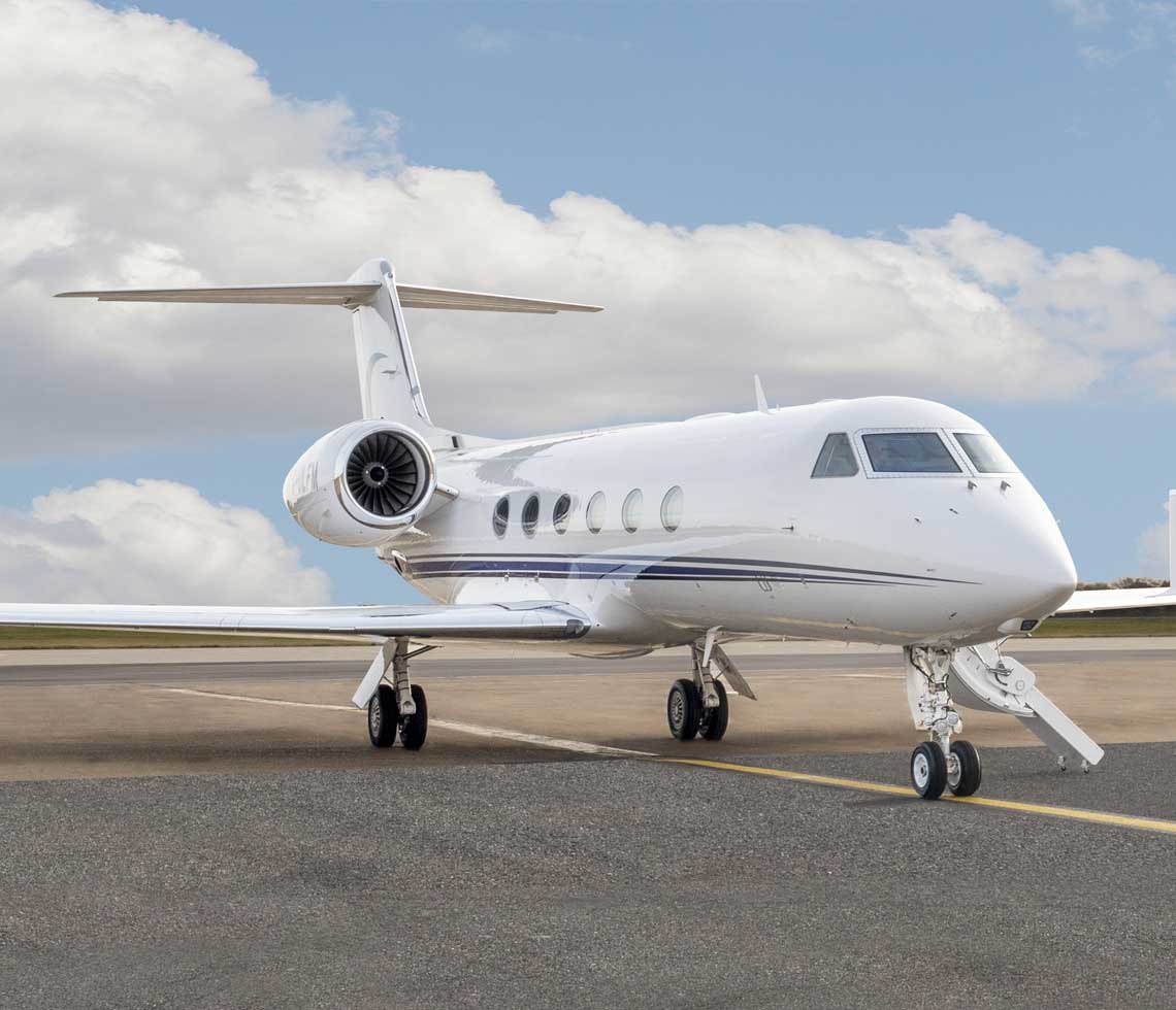 Gulfstream G450 private jet parked on runway