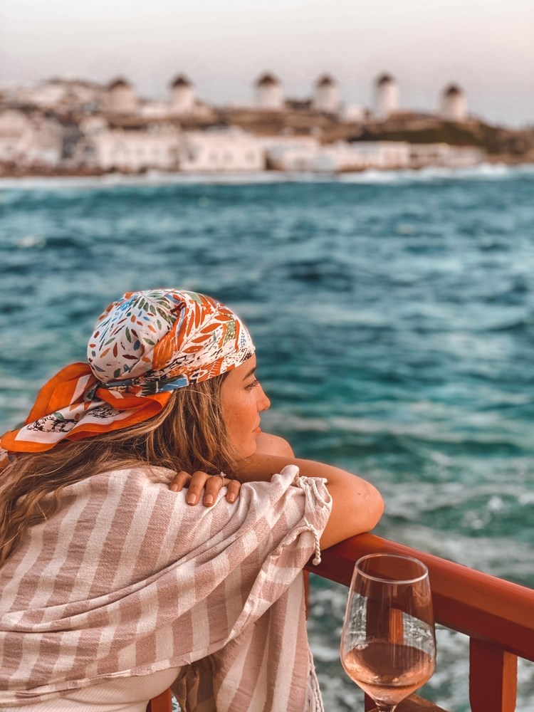 Mykonos - girl looking out to sea