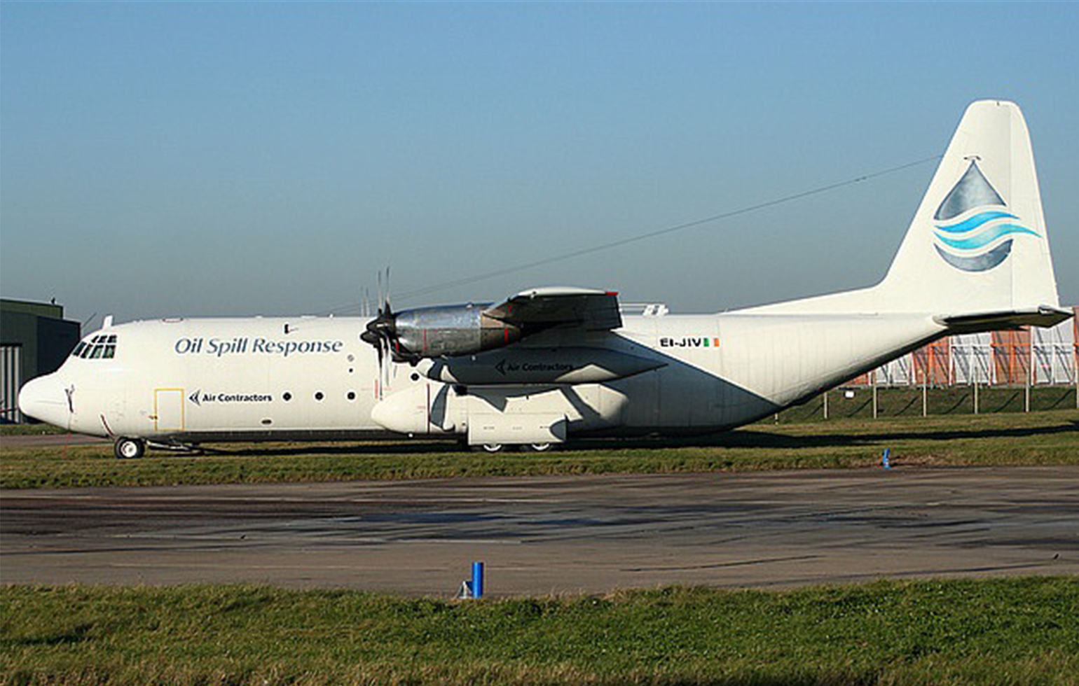 Lockheed L100-Hercules cargo charter aircraft on runway