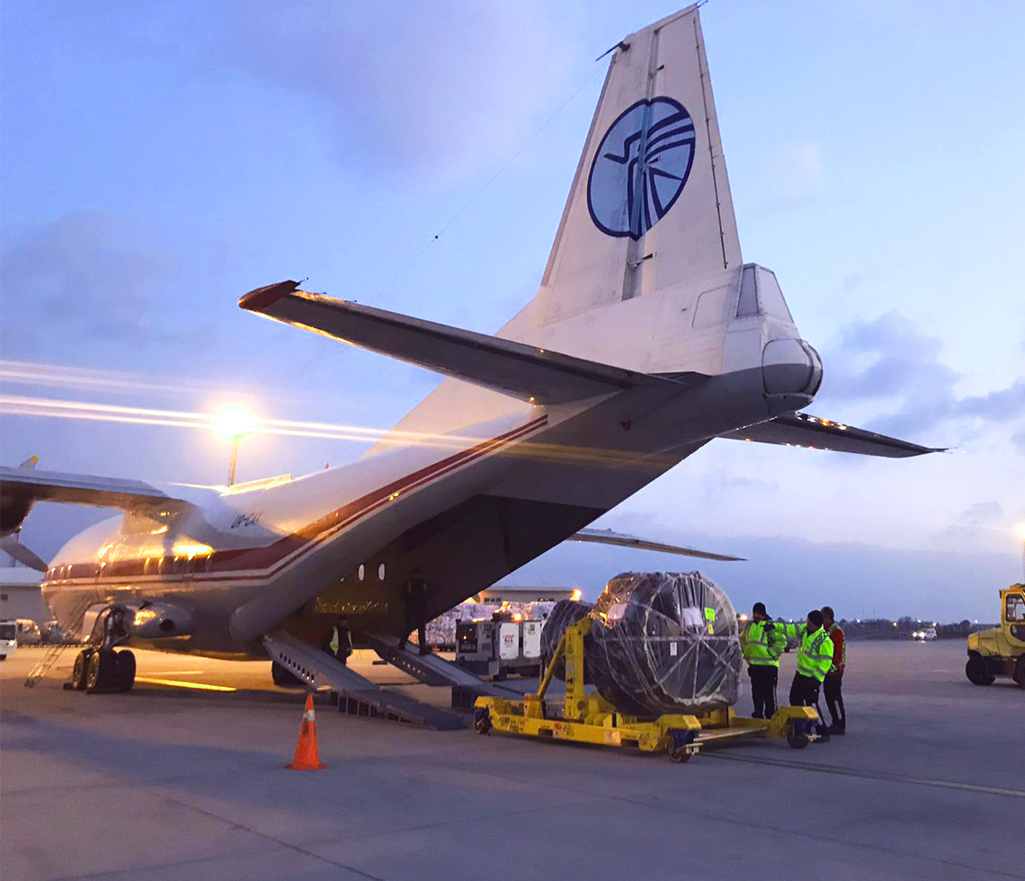 Antonov AN-12 cargo charter logistics with crew on site