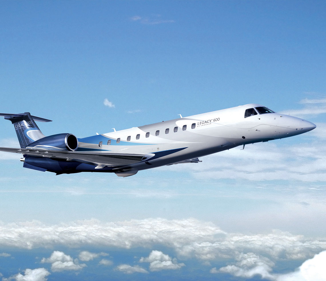 Embraer Legacy 600 private jet flight over clouds