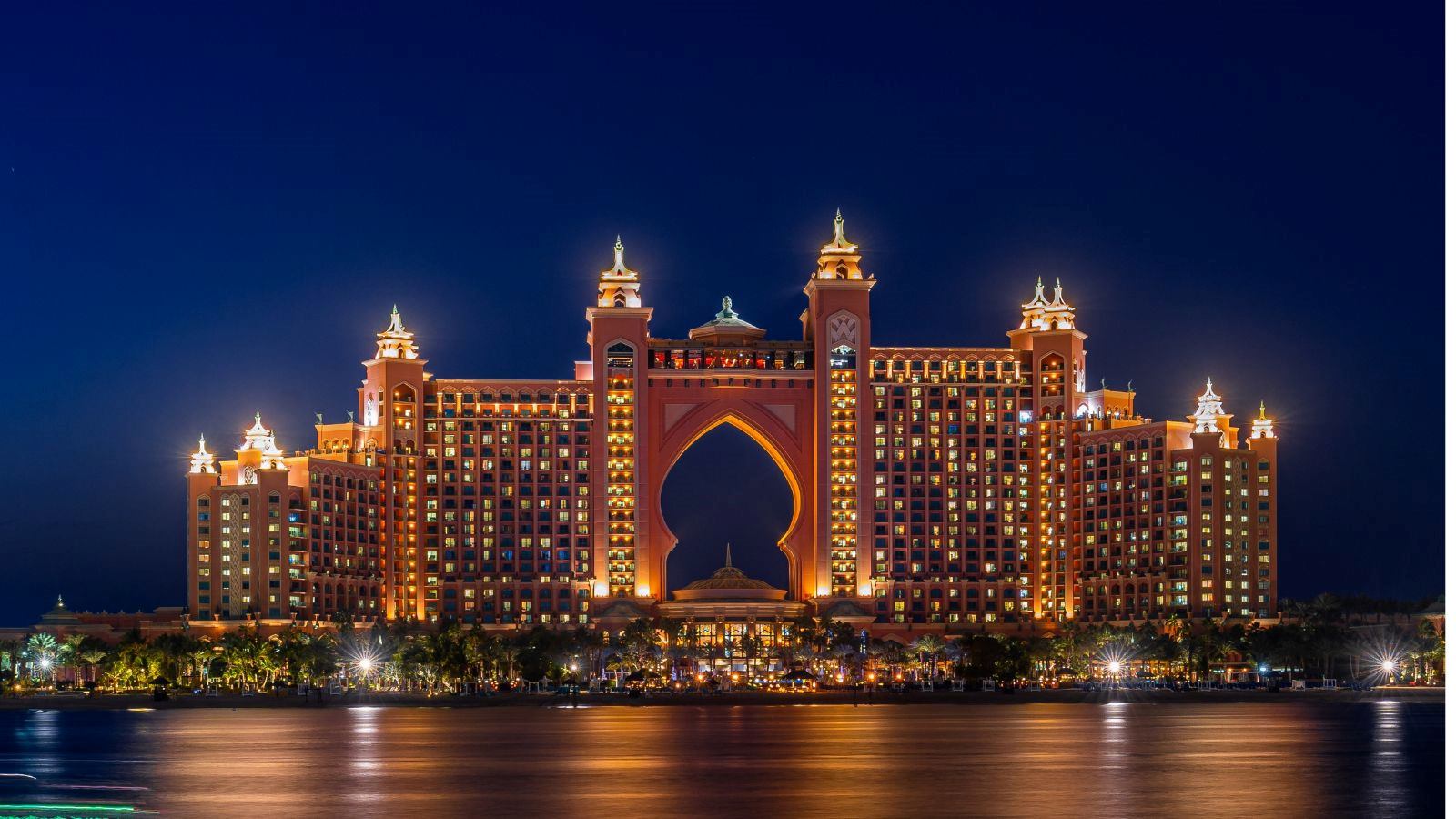 Experience the magic of Dubai's Atlantis hotel at night with our stunning landscape photograph. The iconic hotel, located on the man-made island of Palm Jumeirah