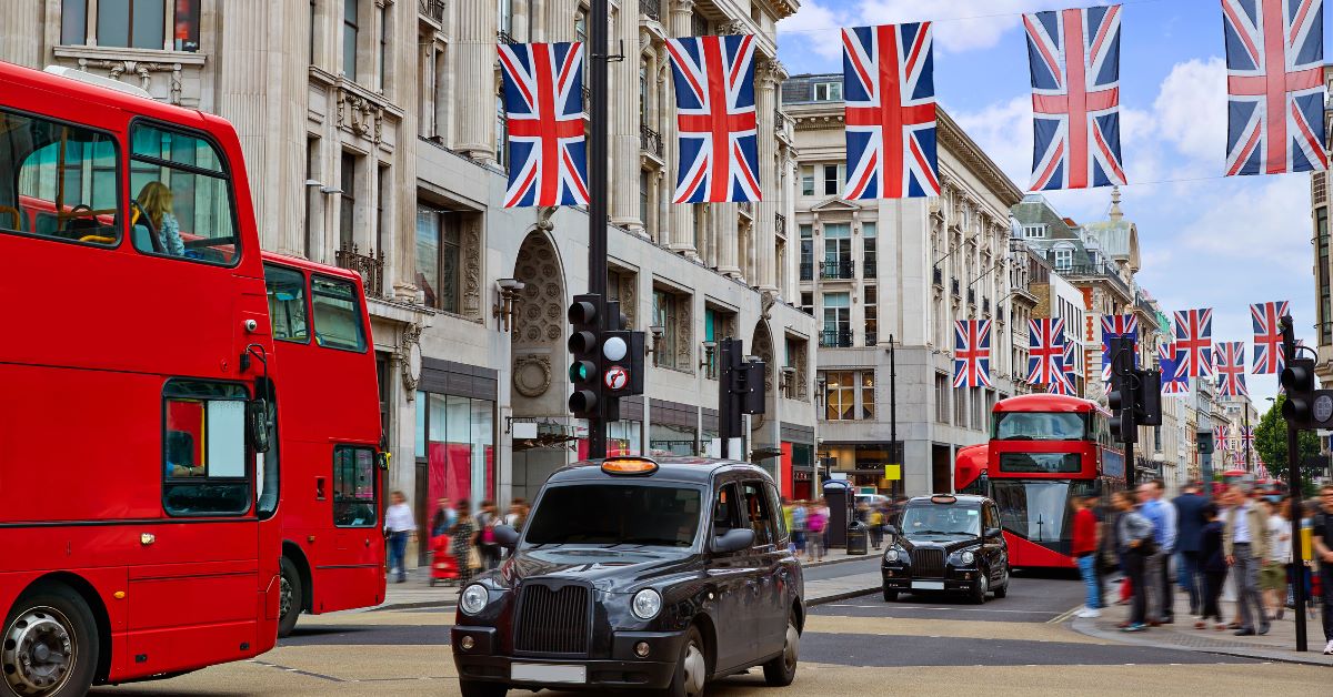 Black can driving down a busy london street